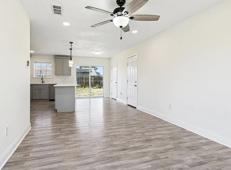 Open living and kitchen with new luxury vinyl flooring